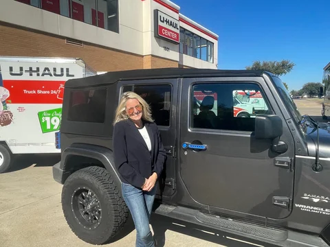 Kristy Purtle helping client move with U-Haul trailer - full service REALTOR